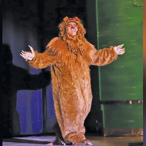 Kevin Aragon, portraying the Cowardly Lion, sings on stage during the Friday presentation of “The Wizard of Oz” at Twin Lakes High School.