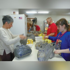 Angela Dold (left), Connor McKinney and Madison Smith place dozens of egg cartons into plastic bags for workers to easily handle while working at the White County Food Pantry.