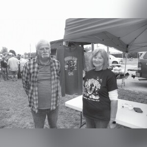 Tom and Karen Bowsher sell the T-shirts the festival provided volunteers and sold to customers wanting one.