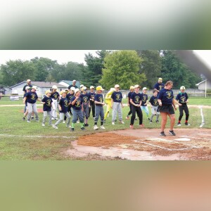 The two teams of Monticello Mini Bananas, Chiquita Bananas and Banana Splits, perform a group dance before the start of the game. Photo by Cheri Shelhart